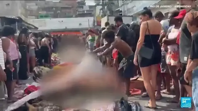 'Video thumbnail for Brazilians in a Rio favela line up bodies after the city's deadliest police raid'