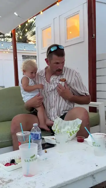 Video thumbnail for Dad Hides a Corn Dog in His Pocket for Sand Free Baby Snack