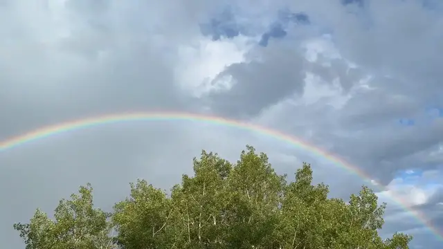 Video thumbnail for US: Rainbow Appears Over Storm Clouds After Days of Severe Weather in Evergreen, CO.