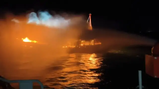 Video thumbnail for China: Eight rescued after fishing boat catches fire in south China.