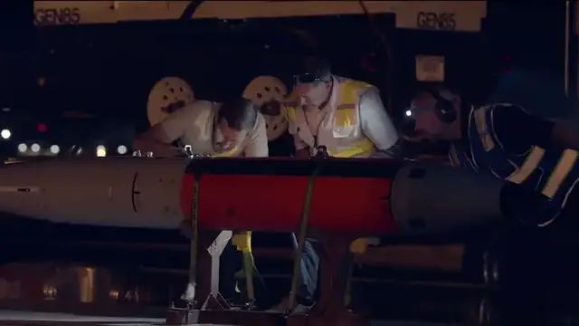 'Video thumbnail for US Air Force and Energy Department personnel load unarmed nuclear bombs into F-35'