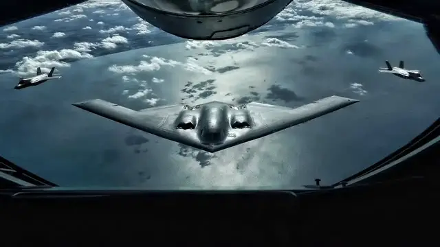 'Video thumbnail for U.S. B-2 Bomber Flies With RAF F-35 Lightning II'