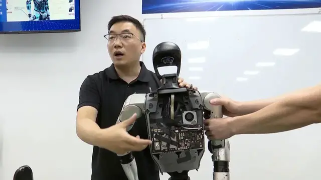 Video thumbnail for China: Robot repair jobs in demand in south China's tech hub.