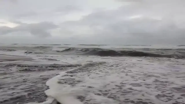 Video thumbnail for US: Choppy Waves Wash Over Outer Banks Beach as Isaias Remnants Move North.
