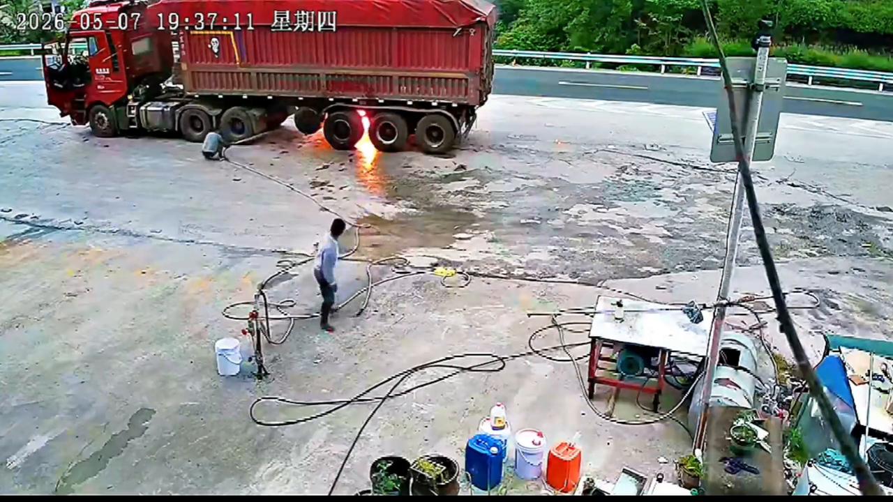 Video thumbnail for China: Emergency rescue captured as burning truck stops outside water station in China.