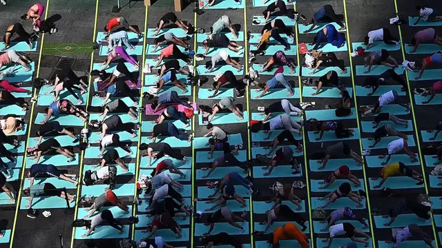 Video thumbnail for NY: Summer Solstice In Times Square - Mind Over Madness Yoga.