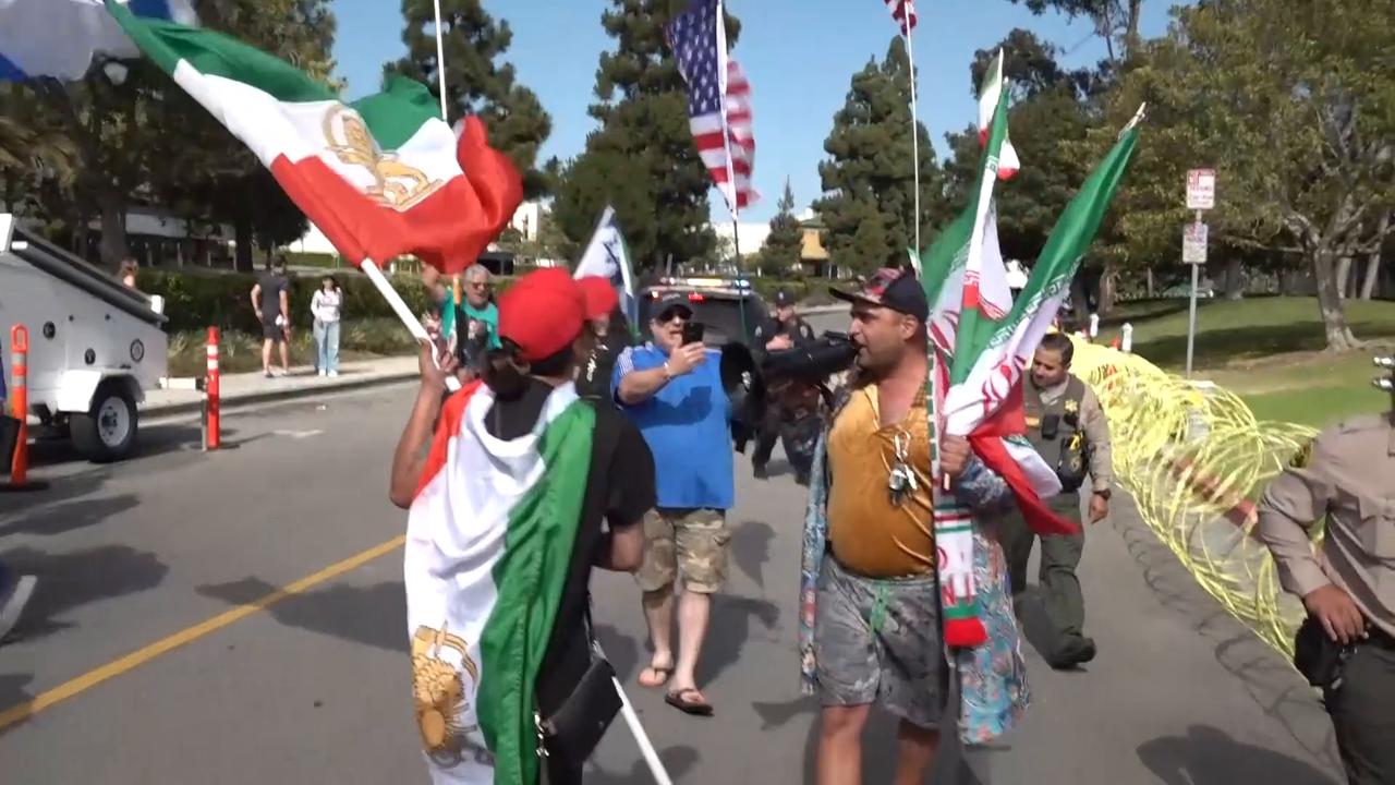Video thumbnail for US: Rival groups clash outside Iran team hotel ahead of World Cup match.