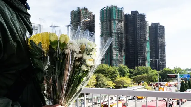 Video thumbnail for Death toll rises to 128 in Hong Kong high-rise fire as 200 remain missing