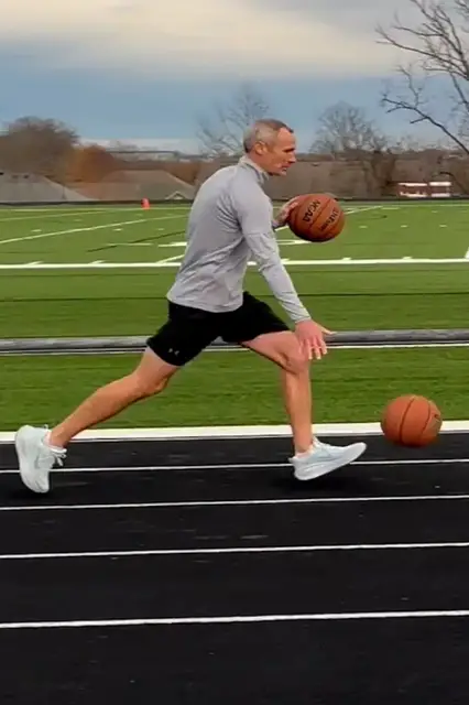 Video thumbnail for Fastest mile dribbling two basketballs - 8 minutes 28.31 seconds by Michael Dodd