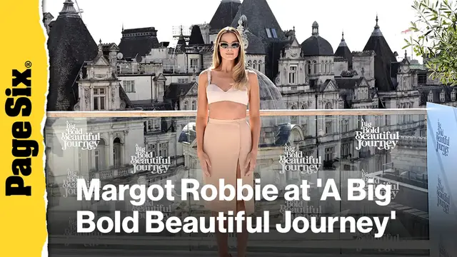 'Video thumbnail for Margot Robbie wears vintage nude bra and skirt set for 'A Big Bold Beautiful Journey' photo call in London'
