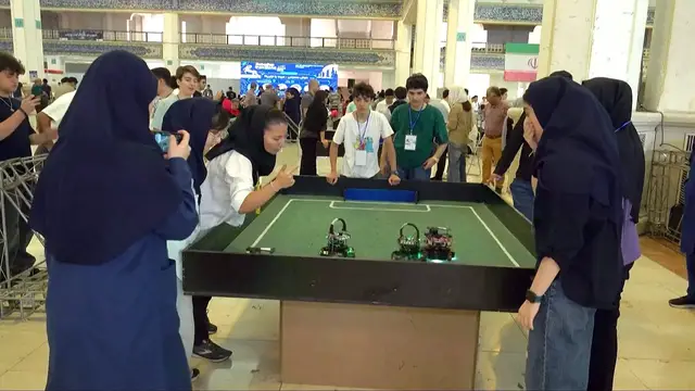 Video thumbnail for Iranian schoolgirls compete in robot football at Tehran's RoboCup
