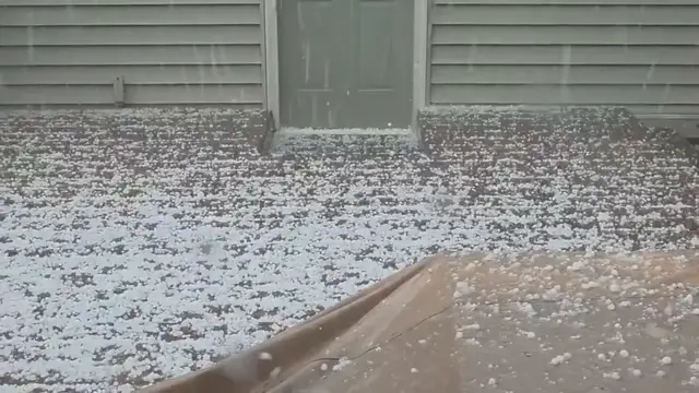 Video thumbnail for US: Hail Blankets Minnesota Neighborhood as Storm Turns Yards White Near Minneapolis.
