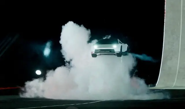 Video thumbnail for Tesla unveils car that can drive upside down and jump through the air