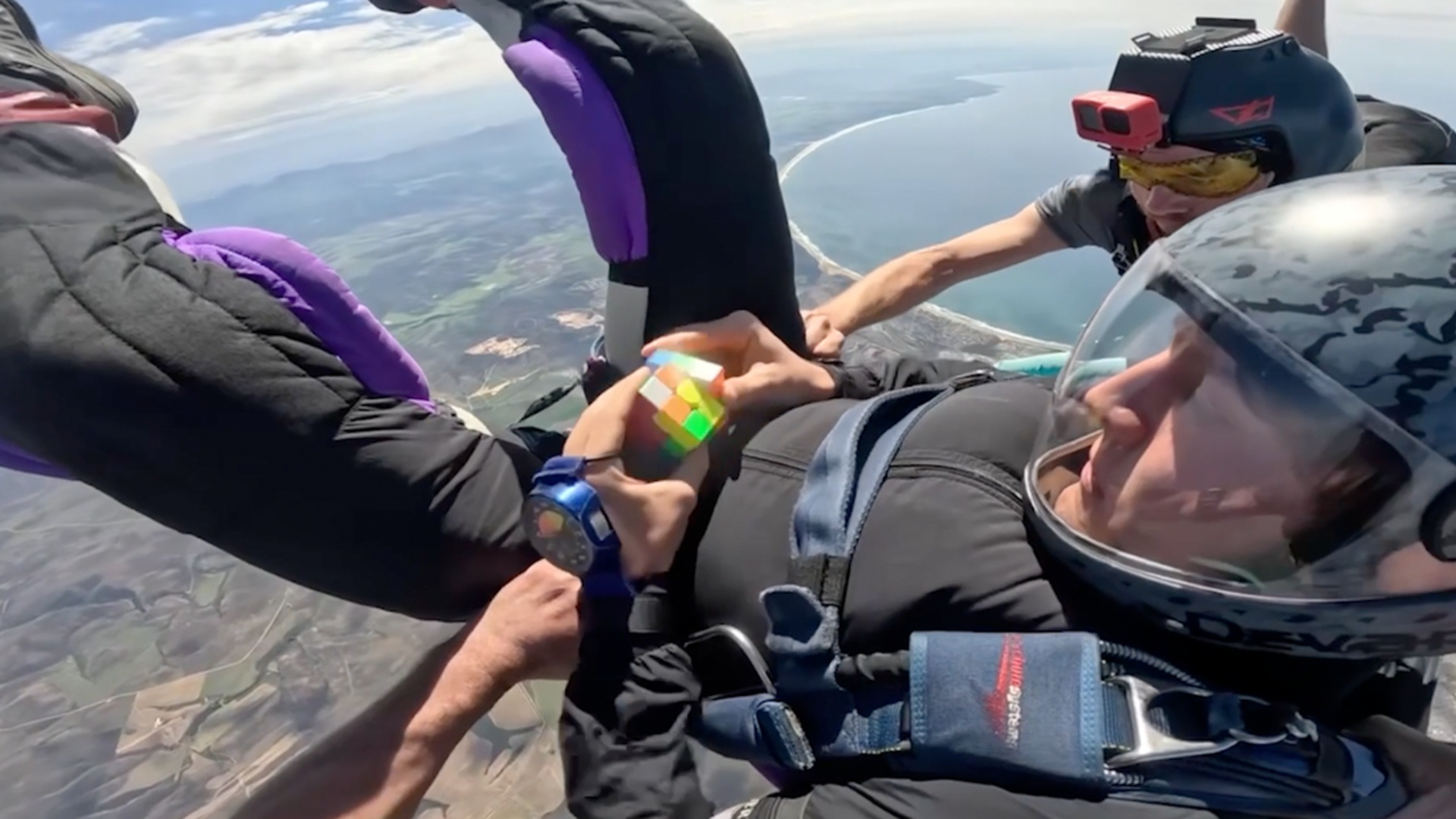 Video thumbnail for Fastest time to solve a rotating puzzle cube whilst in freefall  22.3 seconds by Tom Kopke