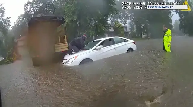 Video thumbnail for East Brunswick police rescue two people trapped in car during flash flooding
