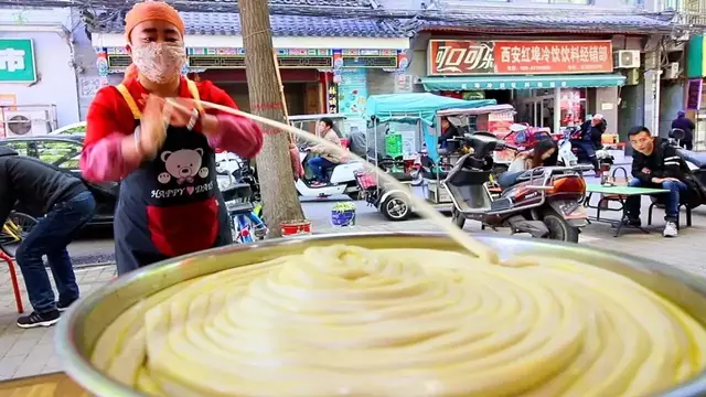 'Video thumbnail for Chinese Street Food - WORLD'S LONGEST NOODLE in Xi'an Muslim Quarter - BEST Street Food in China'