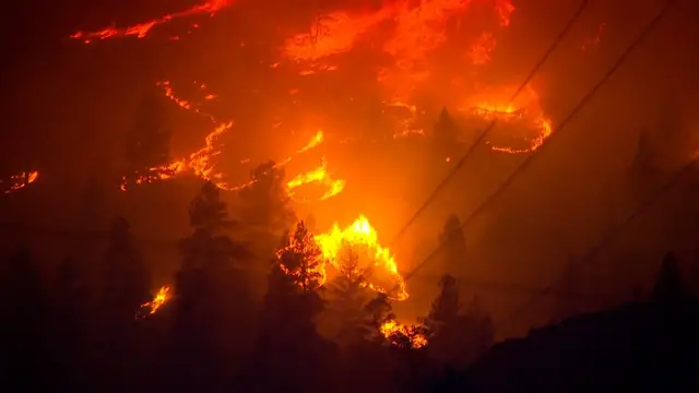 Video thumbnail for Wildfires bear down on homes in Canada's Okanagan region