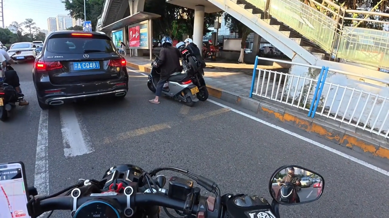 Video thumbnail for Two e-scooter riders collide while passing through traffic in Chongqing, China