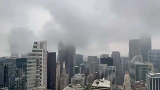 Video thumbnail for US: Skyscraper Tops Disappear Into Storm Clouds Over Chicago.