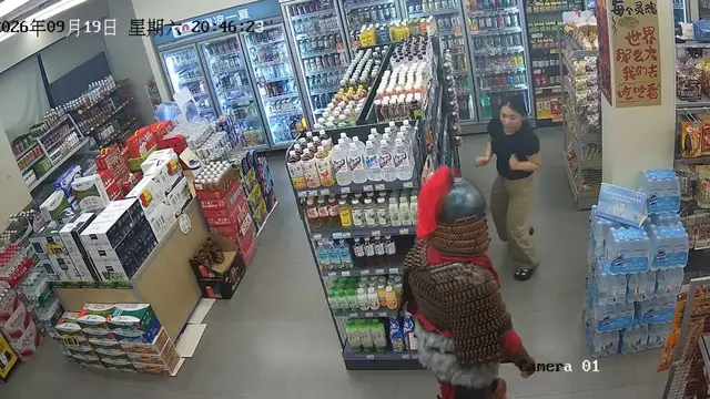 Video thumbnail for Man in Traditional Armor Surprises Store Worker in Guangxi