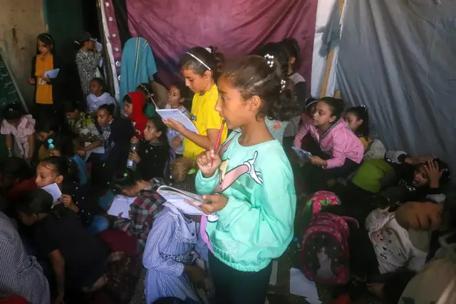 'Video thumbnail for Schools by day, shelters by night: Students return to Gaza classrooms'