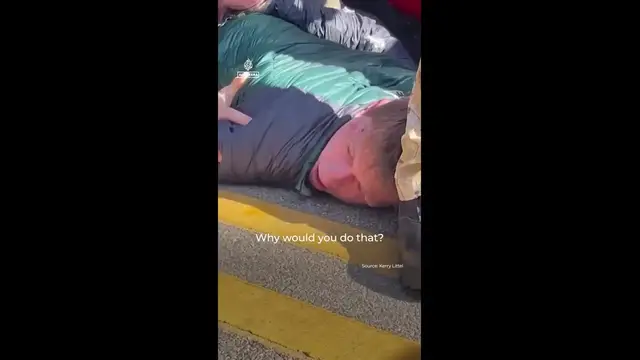 'Video thumbnail for US federal agent in Chicago punches restrained man’s head on the ground'