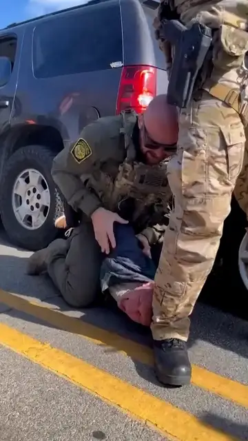 'Video thumbnail for US federal agent in Chicago punches restrained man’s head on the ground'