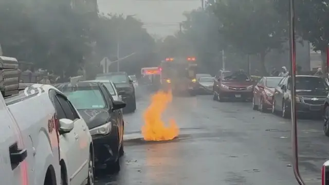 Video thumbnail for Flames shoot from grate during manhole blaze in Brighton Beach
