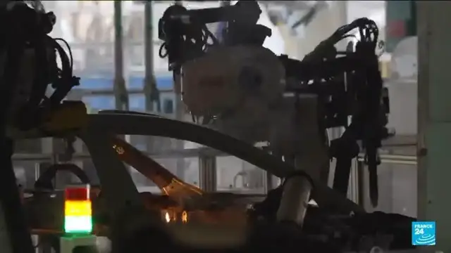 Video thumbnail for Inside China's 'dark factories' where robots run the production lines