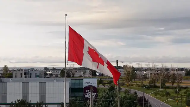 Video thumbnail for Canada: Canadian Flag at Sunrise Over Markham, Ontario 2.