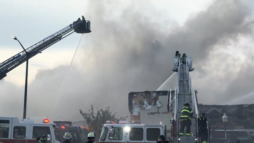 Video thumbnail for More than 40 different fire departments arrive to battle fire at strip of Central Islip businesses