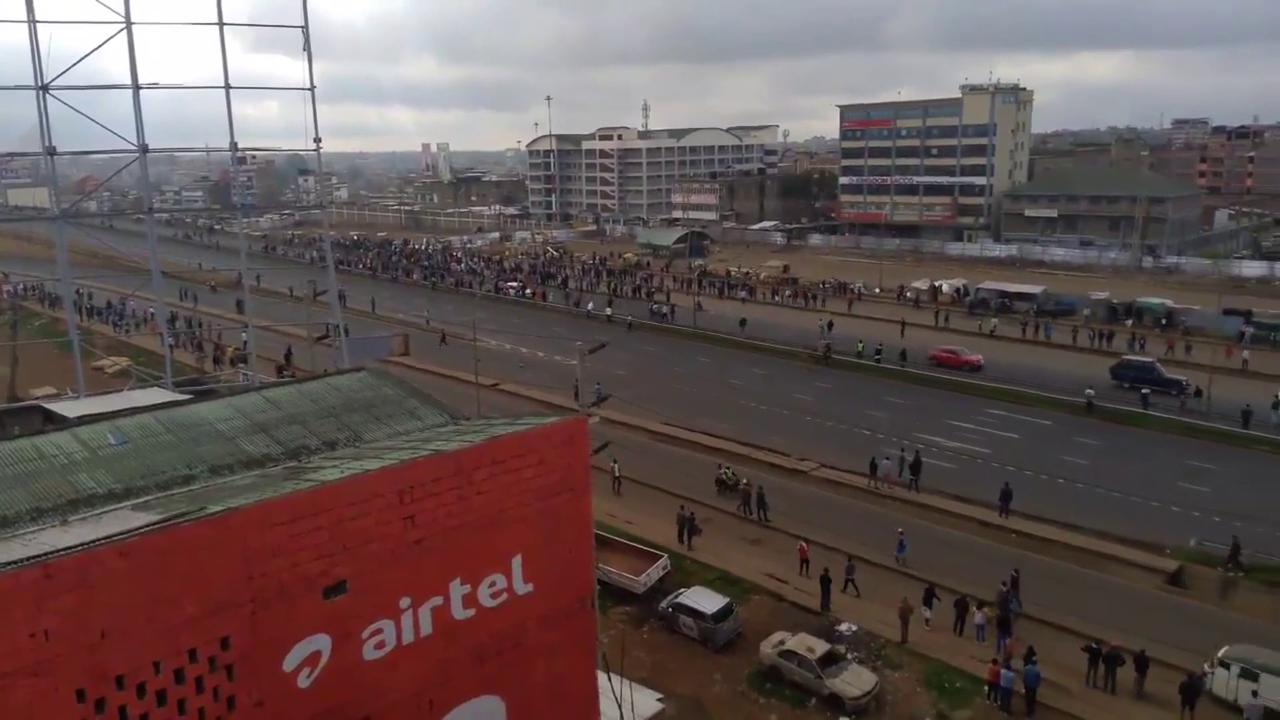 Video thumbnail for Kenya: Hundreds Flood Highway In Kenya During Protest Against Rising Fuel Prices.