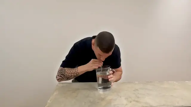 Video thumbnail for Fastest time to drink one litre of water through a straw - 12.97 seconds by Andre Ortolf