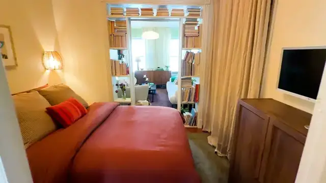 Video thumbnail for House Tour: This NYC Apartment’s Bedroom Is Smack Dab in the Middle of the Home (It’s Not a Studio!)