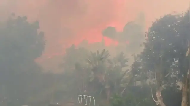 Video thumbnail for US: Inferno Rages at Backyard's Edge as Fierce Winds Fan Southern California Wildfire.