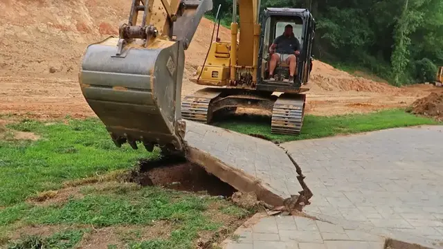 Video thumbnail for Excavator Removing Concrete Slab