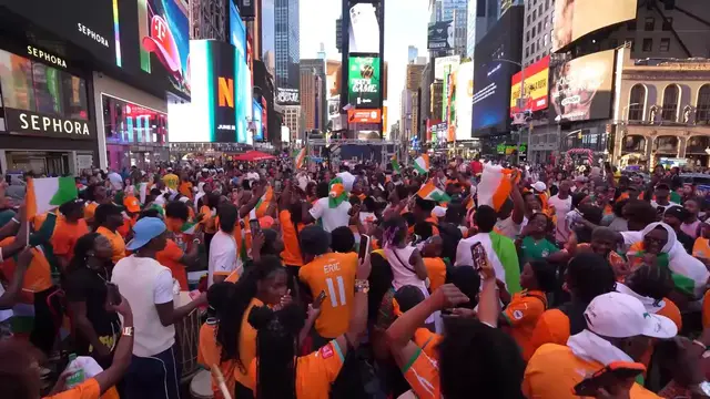 Video thumbnail for US: Ivory Coast fans rally in Times Square ahead of Germany World Cup clash.