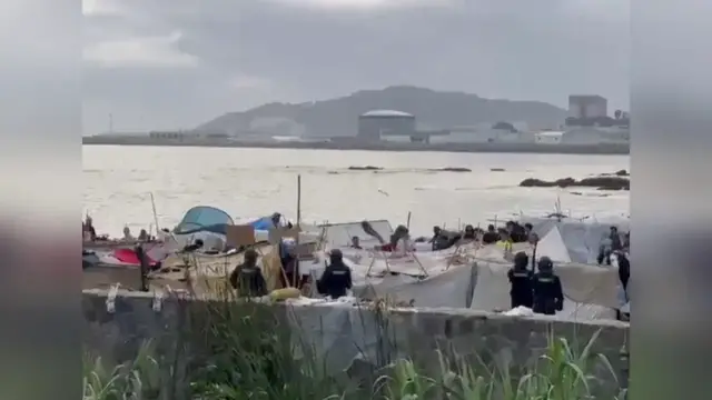 Video thumbnail for Spain: Riot Police Clear Migrant Camps In Ceuta As Migrants Are Moved Onto Buses.