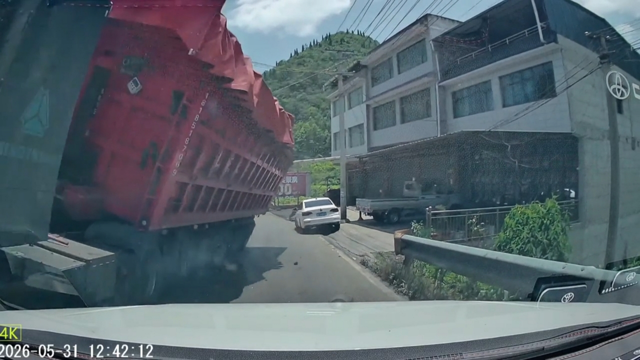 Video thumbnail for Truck Teeters But Stays Upright on Narrow Mountain Road