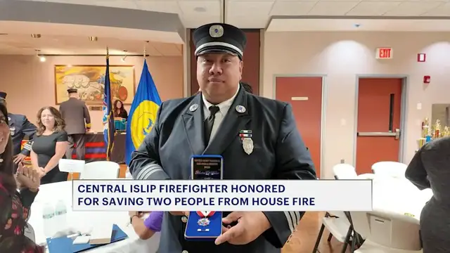 Video thumbnail for Central Islip firefighter receives Gold Medal of Valor for rescuing two people from house fire
