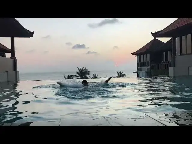'Video thumbnail for Cloud-Kissed Sunset from a Rooftop Pool | Kuta Beach, Bali Evening Calm'