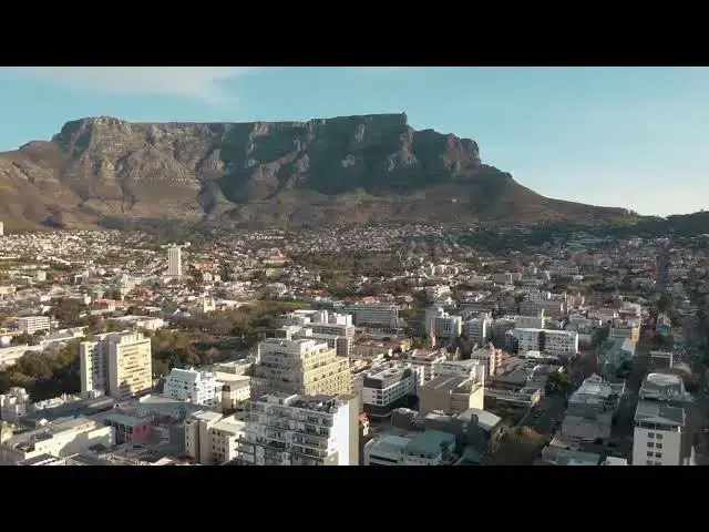 Video thumbnail for Aerial View of Town Near Mountain