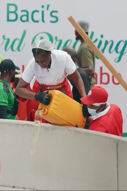 'Video thumbnail for Largest serving of Nigerian style jollof rice - 8,780 kg (19,356 lb 9 oz) by Hilda Baci and Gino'