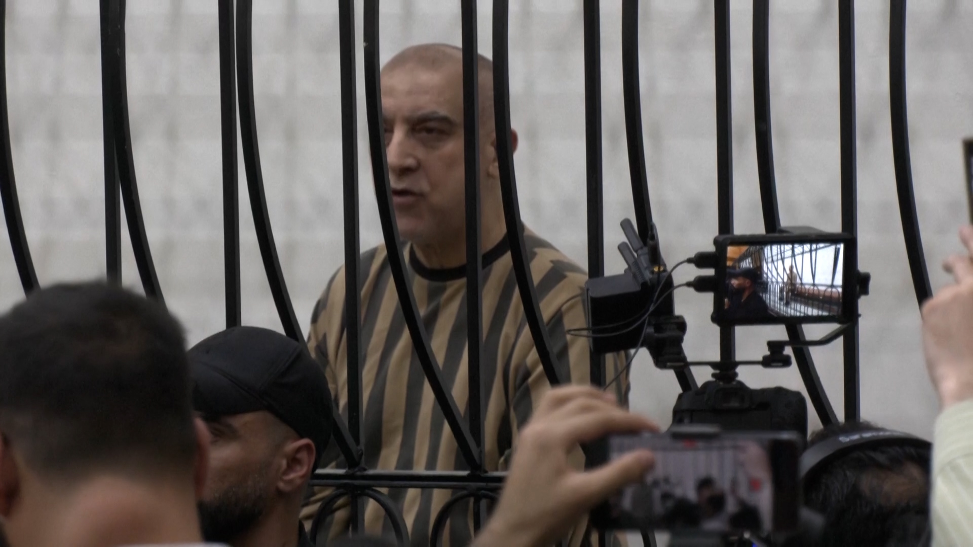 Video thumbnail for Atef Najib, al-Assad’s cousin, in Syrian court in landmark trial