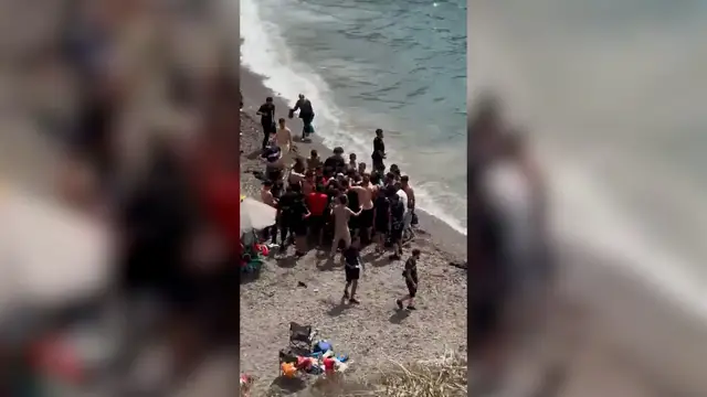 Video thumbnail for Dozens of migrants land on Spanish coast surprising beachgoers
