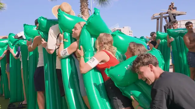 Video thumbnail for Largest human air bed/lilo dominoes - 878 participants achieved by BYE BYE WEEK