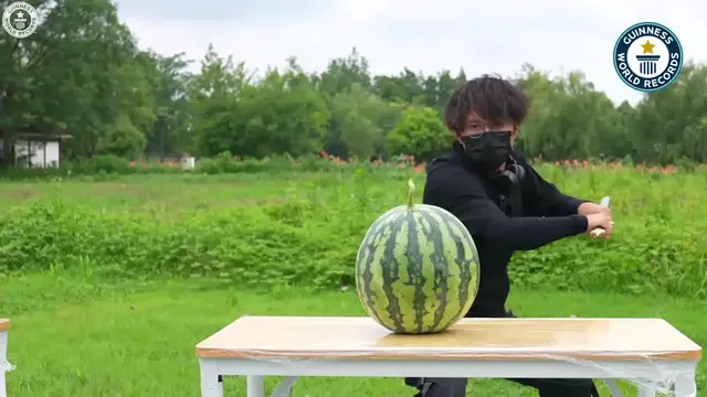 'Video thumbnail for Fastest time to cut 10 watermelons with a sword - 9.03 seconds by Fan Peng'