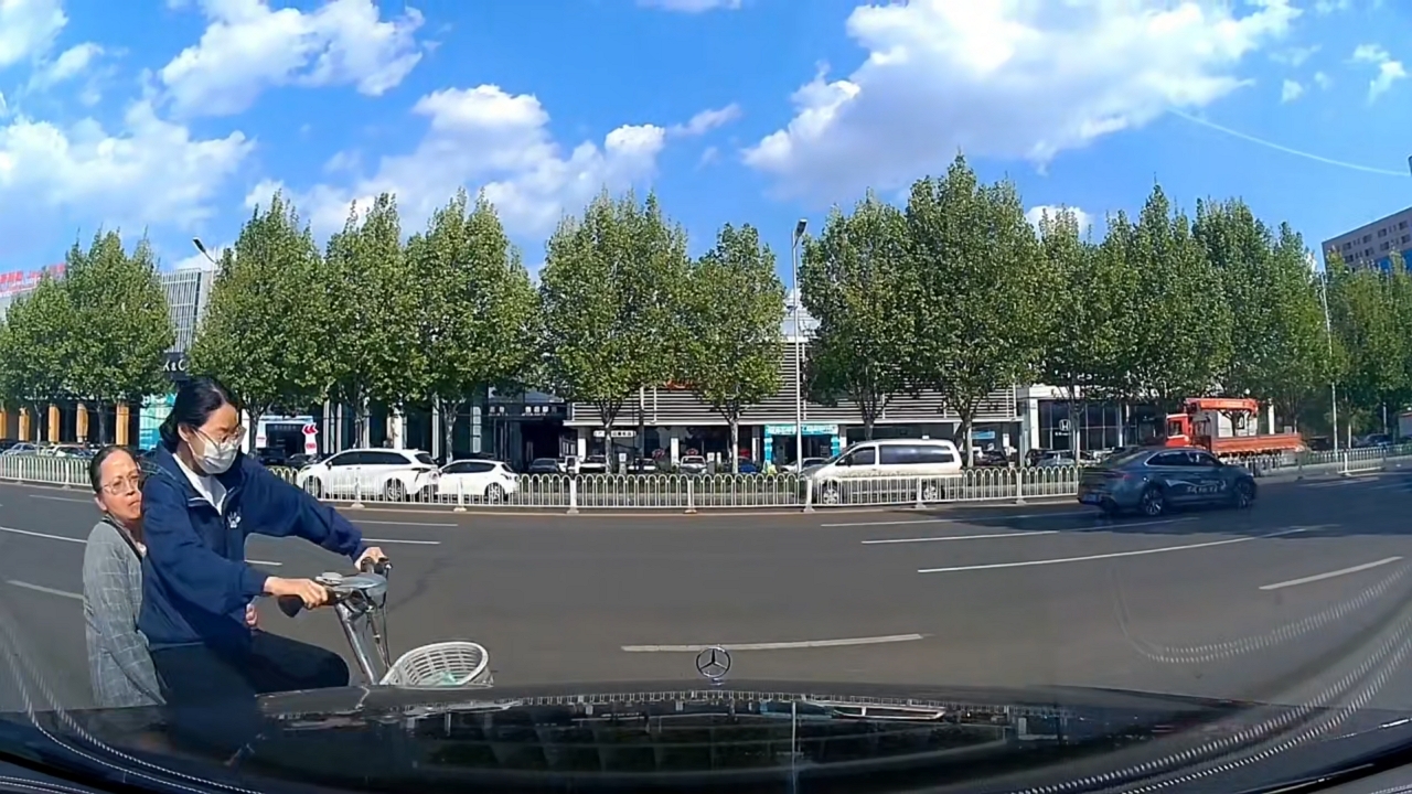 Video thumbnail for E-bike Smashes into Car Exiting Parking in Hebei