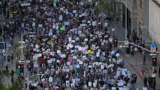 'Video thumbnail for Tens of thousands march in anti-Trump protests across the US'