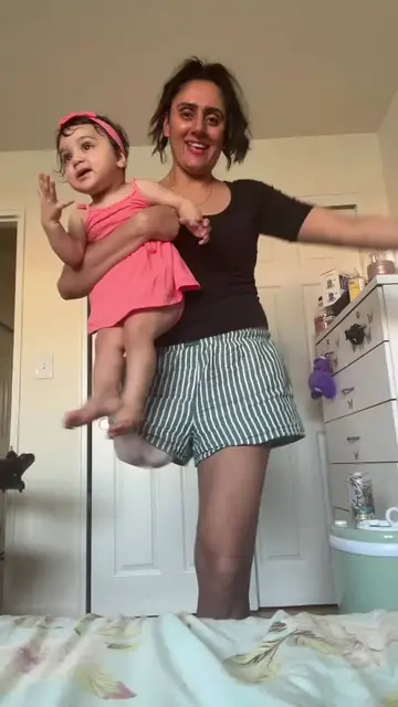 Video thumbnail for One-Legged Mother Dancing with Baby Daughter to Punjabi Song